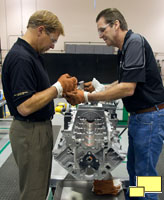 November 29, 2011: The 100 Millionth Small Block Chevy Engine is Built by Dave Cetnar of the UAW (left), with the guidance of GM Experimental Assembler John Ross, at the GM Performance Build Center in Wixom, Michigan